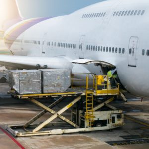 Ground crew Loading Cargo onto Airplane